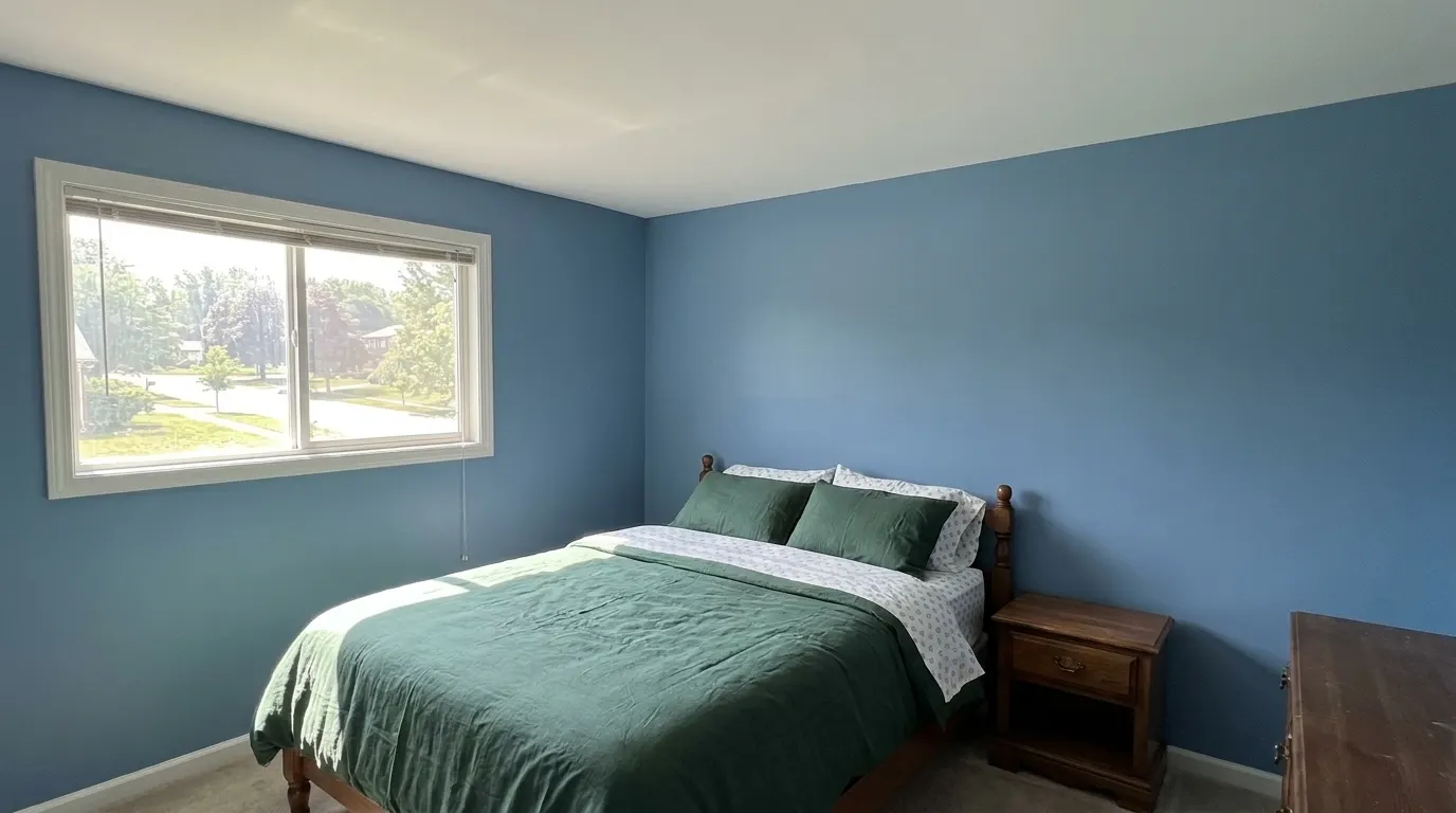 Same bedroom with rebuilt ceiling after storm damage restoration
